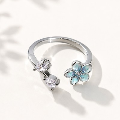 Anillo flor ajustable plateado con cristales y esmalte azul ADORAVI
