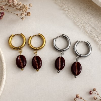 Pendientes grano de café disponibles en acero inoxidable dorado y plateado.